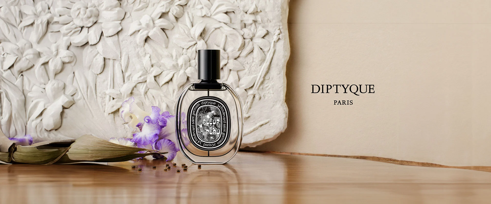 Hinh anh 3: Chai nuoc hoa Diptyque voi thiet ke nghe thuat, bieu tuong cua mui huong niche cao cap.